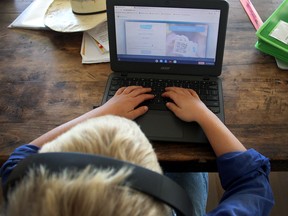A child uses a laptop computer