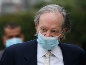 Bill Gross wearing a blue surgical face mask.