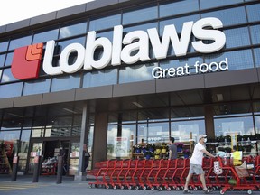 A customer exits a Loblaws store in Ottawa.