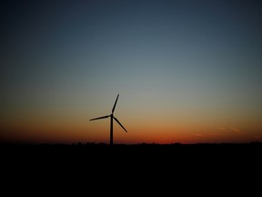 A wind turbine at sunset.