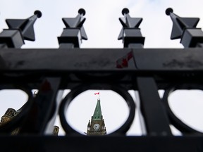 The Peace Tower through a fence on Parliament Hill.