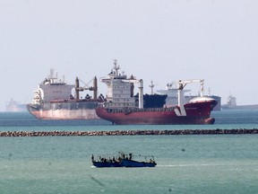 Ships and boats are seen at the entrance of Suez Canal on March 28, 2021.