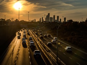 ars make their way in and out of Toronto via the Gardiner Expressway.