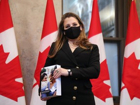 Finance Minister Chrystia Freeland poses with a copy of the federal budget before tabling it in the House of Commons on April 19.
