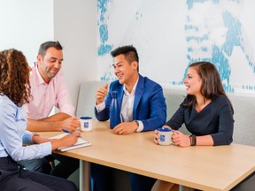 Pre-pandemic, employees meeting in an RBC Oasis Social Collaboration Space.