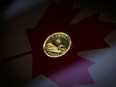 A loonie on a Canadian flag