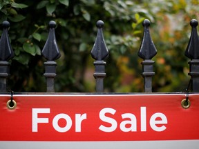 A for sale sign on a fence in Ottawa