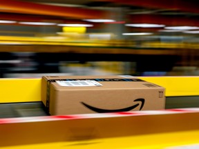 An Amazon Prime parcel passes along a conveyor at an Amazon.com Inc. fulfillment centre.