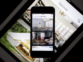 The Airbnb Inc. application on an iPhone and iPad.