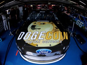 The #98 Dogecoin / Reddit.com Ford, driven by Josh Wise, is seen in the garage during practice for the NASCAR Sprint Cup Series Aaron's 499 at Talladega Superspeedway on May 2, 2014 in Talladega, Alabama.
