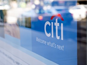 Signage is displayed in the window of a Citigroup Inc. Citibank branch in Chicago, Illinois.