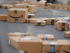 Packages emblazoned with Amazon logos travel along a conveyor belt inside of an Amazon fulfillment centre in Robbinsville, New Jersey.