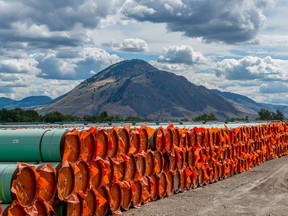 Steel pipe to be used in the oil pipeline construction of the Trans Mountain Expansion Project lies at a stockpile site in Kamloops, British Columbia.