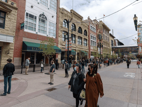 People wait in line to receive a COVID-19 vaccine on Wednesday, May 19, 2021 in Calgary.