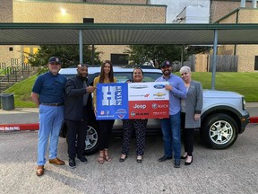 Susanna Salazar was presented with a 2 year lease on a 2021 Ford Bronco for the Huntsville ISD "teacher of the year" as a part of the Henson's Hometown Heroes initiative.