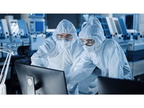 Scientists in a bioproduction laboratory