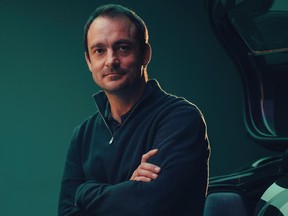 Fraser Dunn, chief engineer of special projects for Aston Martin Lagonda Ltd., pictured with the Valkyrie, a supercar, made for billionaires. Dunn is quitting Aston Martin to join Project Arrow, a Canadian effort to build a zero emissions car for families and create a Tesla north.