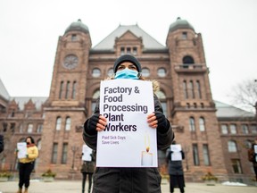 Front-line workers protest in front of the Ontario provincial legislature at Queen's Park in Toronto in January to demand paid sick days for all workers. At the end of April, a bill to provide three paid sick days passed into law in Ontario.