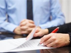 A person signing a contract