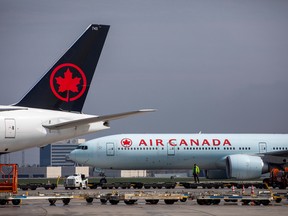 Air Canada planes are parked at Toronto Pearson Airport.