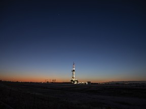 An active oil drilling rig stands in Midland, Texas.