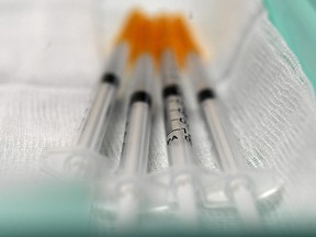 syringes containing doses of the Pfizer-BioNtech COVID-19 vaccine.