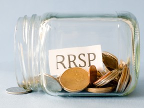 Coins and the letters RRSP in a jar