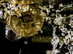 Bitcoin sinking in water