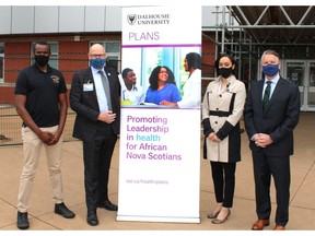 L – R - Sydney Mogae, Teacher, Citadel High School, Stephen Harding, President and CEO, Dartmouth General Hospital Foundation, Sarah Upshaw, PLANS Program Manager, and Mike Roberts, Chief Human Resources Officer, Emera stand outside of Citadel High School. Citadel High is one of five schools that offers PLANS programming.