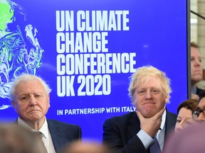 Sir David Attenborough and Prime minister Boris Johnson, right, attend an event about the COP26 UN Climate Summit in February 2020.