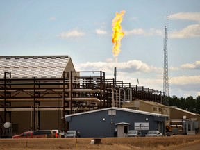The suspension of steam generation forces this East Primrose steam plant to flare natural gas at Canadian Natural Resources Limited's (CNRL) Primrose Lake oil sands project near Cold Lake, Alberta.