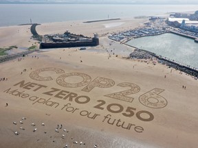 A giant sand artwork adorns New Brighton Beach to highlight global warming and the Cop26 global climate conference on May 31, 2021 in Wirral, Merseyside.
