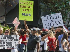 Hundreds of protesters gathered at Yonge Dundas Square to protest COVID-19 safety measures and the lockdown in September 2020.