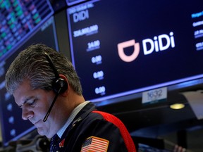 A trader works during the IPO for Chinese ride-hailing company Didi Global Inc on the New York Stock Exchange on Wednesday, June 30, 2021.