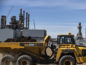 A truck hauls dirt at the Inter Pipeline Heartland Petrochemical Complex under construction in Strathcona County, Alberta. Brookfield Infrastructure Partners LP and Pembina Pipeline Corp. are in a bidding war for the company.