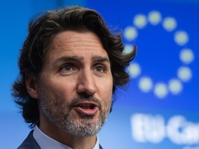 Prime Minister Justin Trudeau speaks during a news conference following a European Union and Canada summit in Brussels, Belgium, on Tuesday. Canada and the European Union launched a new partnership to secure supply chains for critical minerals and reduce dependence on China in a push for jobs and to counter climate change.