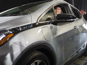 Prime Minister Justin Trudeau arrives in a 2017 Chevrolet Bolt electric car during the announcement that GM plans to hire up to 1000 engineers in Canada at the GM plant in Oshawa, ON in 2016.