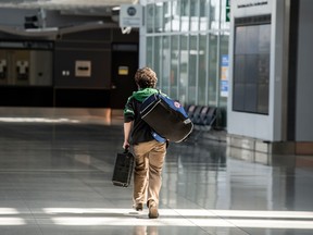 A traveller in the departures area of Terminal 1 at Toronto Pearson International Airport, Friday April 23, 2021.