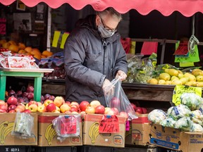 A man shops for groceries at a store in Toronto.