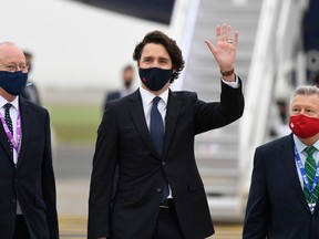 Canadian Prime Minister Justin Trudeau waves as he arrives ahead of the G7 meeting at Cornwall airport on June 10, 2021 in Newquay, England.