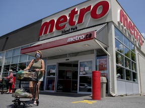 A customer exits a Metro grocery store in Ottawa.