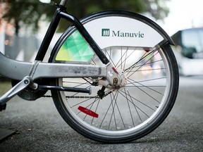 Manulife Financial Corp. signage is displayed on a bicycle in Montreal.