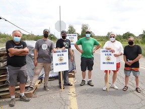 United Steelworkers Local 6500 members picket at the entrance to Vale's nickel refinery in Copper Cliff, Ont.