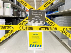 An aisle of non-essential goods is cordoned off at a Walmart store in Toronto in April during COVID restrictions.