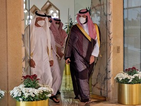 A handout picture provided by the Saudi Royal Palace shows Saudi Crown Prince Mohammed bin Salman (R) receiving Crown Prince of Abu Dhabi and Deputy Supreme Commander of the Emirati Armed Forces Mohammed bin Zayed, at the King Khaled International airport in the capital Riyadh, on July 19, 2020.