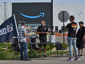 Teamsters Local 362 and supporters outside the Amazon Warehouse, talking to workers and informing them about unions in south Edmonton this month.
