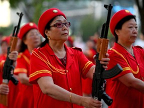 Elderly people perform a patriotic dance in front of a mall in Beijing in June. China is projected to see a decline in its working-age population over the course of this decade.