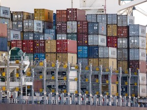 Shipping containers stand stacked on a container ship at Hamburg port, Germany's biggest international trade port.