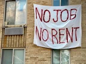 A banner against renters eviction hangs on an apartment building during the pandemic in August, 2020, when COVID restrictions had shut down many businesses, putting millions out of work.