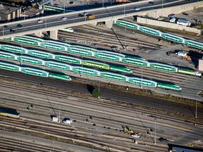 Metrolinx GO passenger trains sit in a rail yard in this aerial photograph taken above Toronto, in 2017.